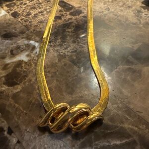 Vintage Gold Tone Herringbone Necklace with Sculptural Swirl Centerpiece
